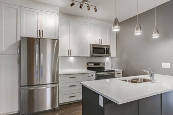 Bright white kitchen with a quartz island