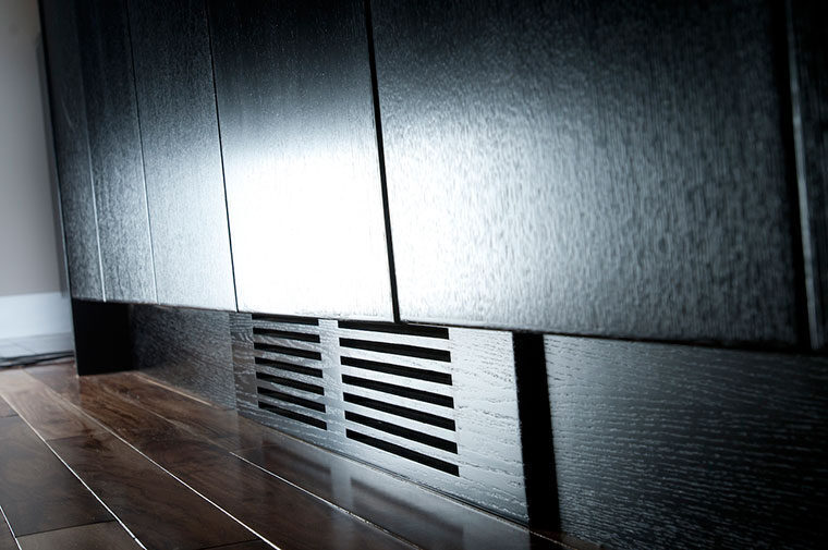 Detailed black cabinetry toe-kick venting