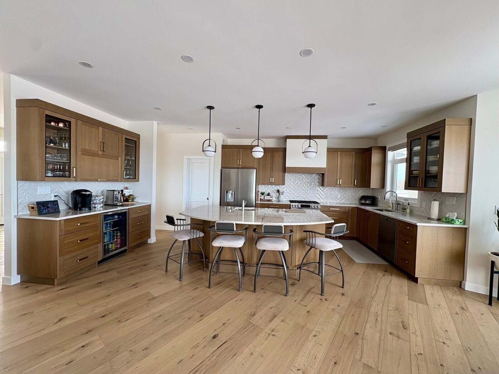 Bright custom kitchen with wood island and white cabinetry
