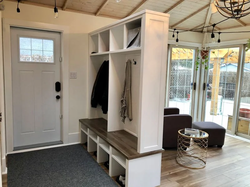 Entry mudroom with lockers and a bench