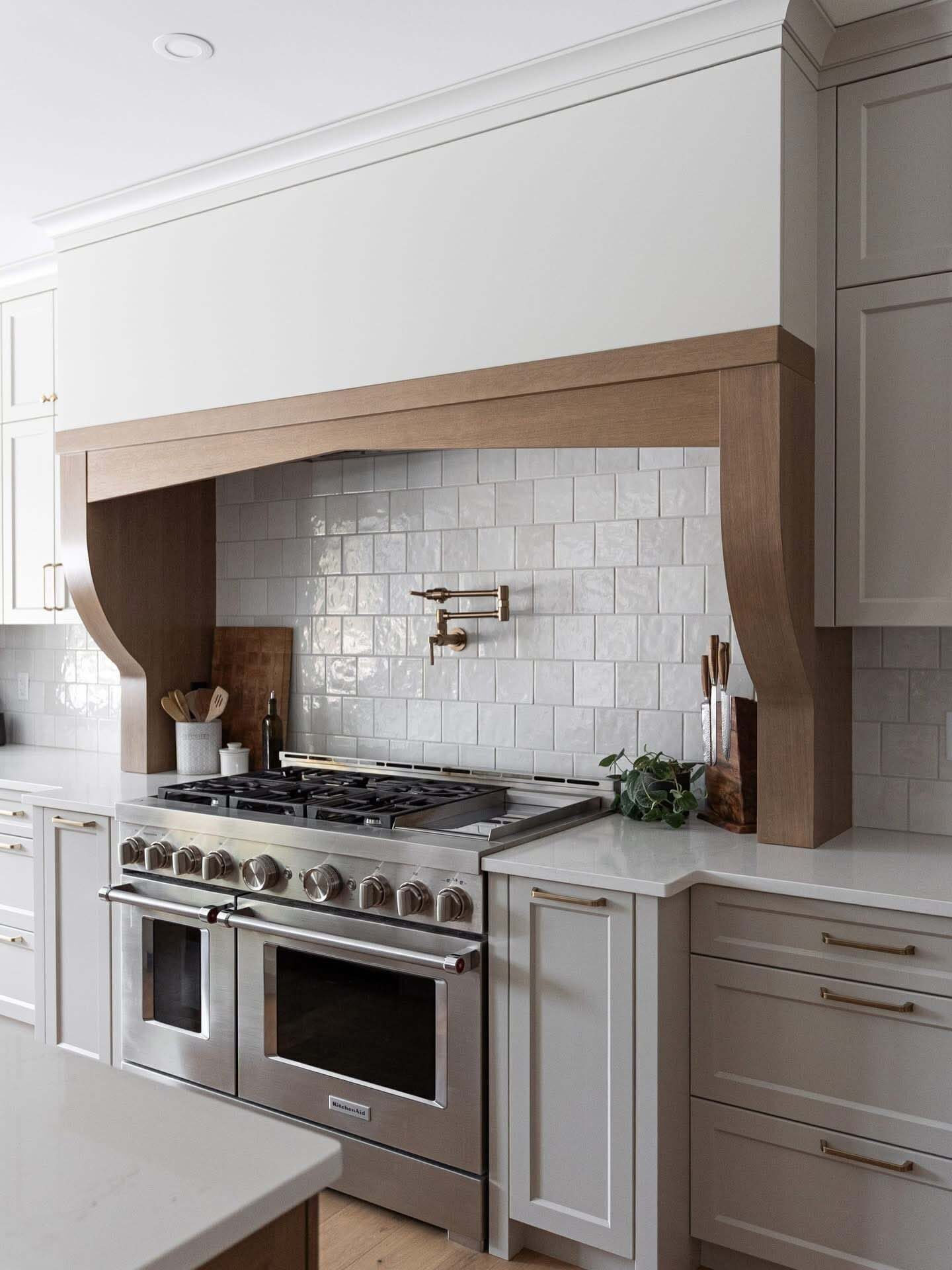 Arched custom range hood over pro range
