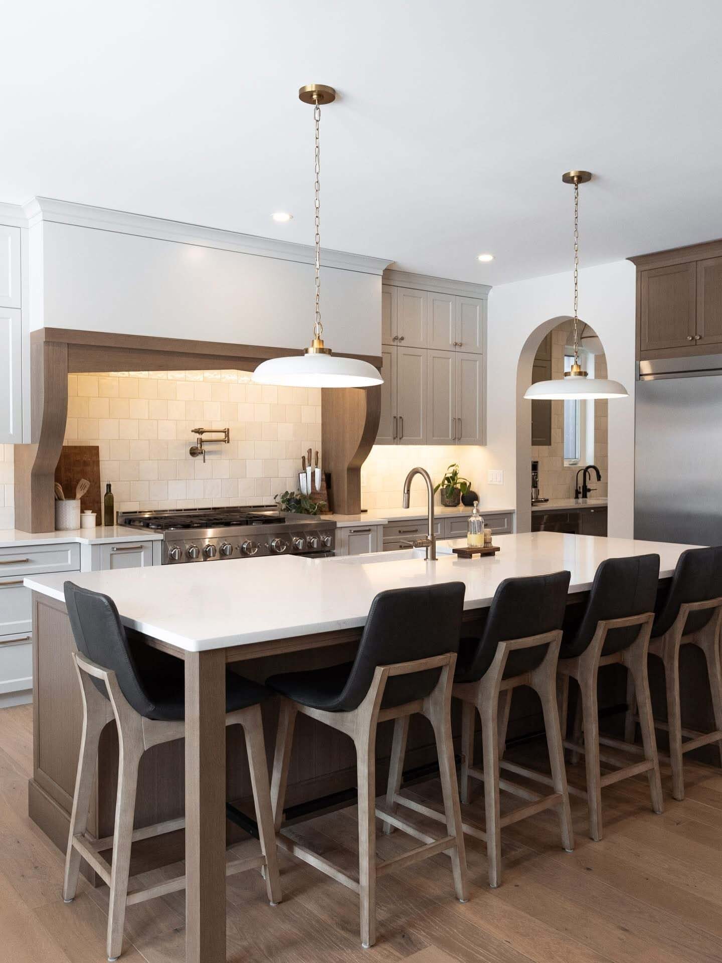 Kitchen with a long island, pendants, and seating