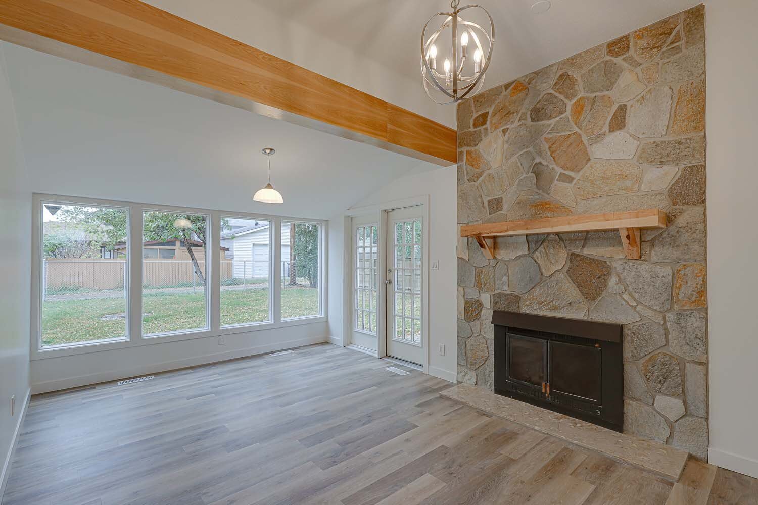 Stone fireplace with wood mantel