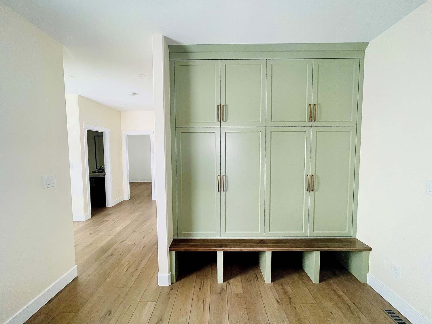 Green mudroom lockers with bench