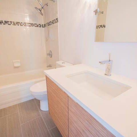 Undermount bath sink in a wood vanity