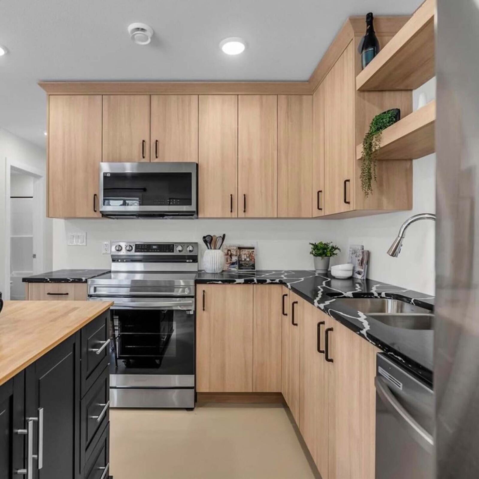 Dark cabinetry with deep stone countertops