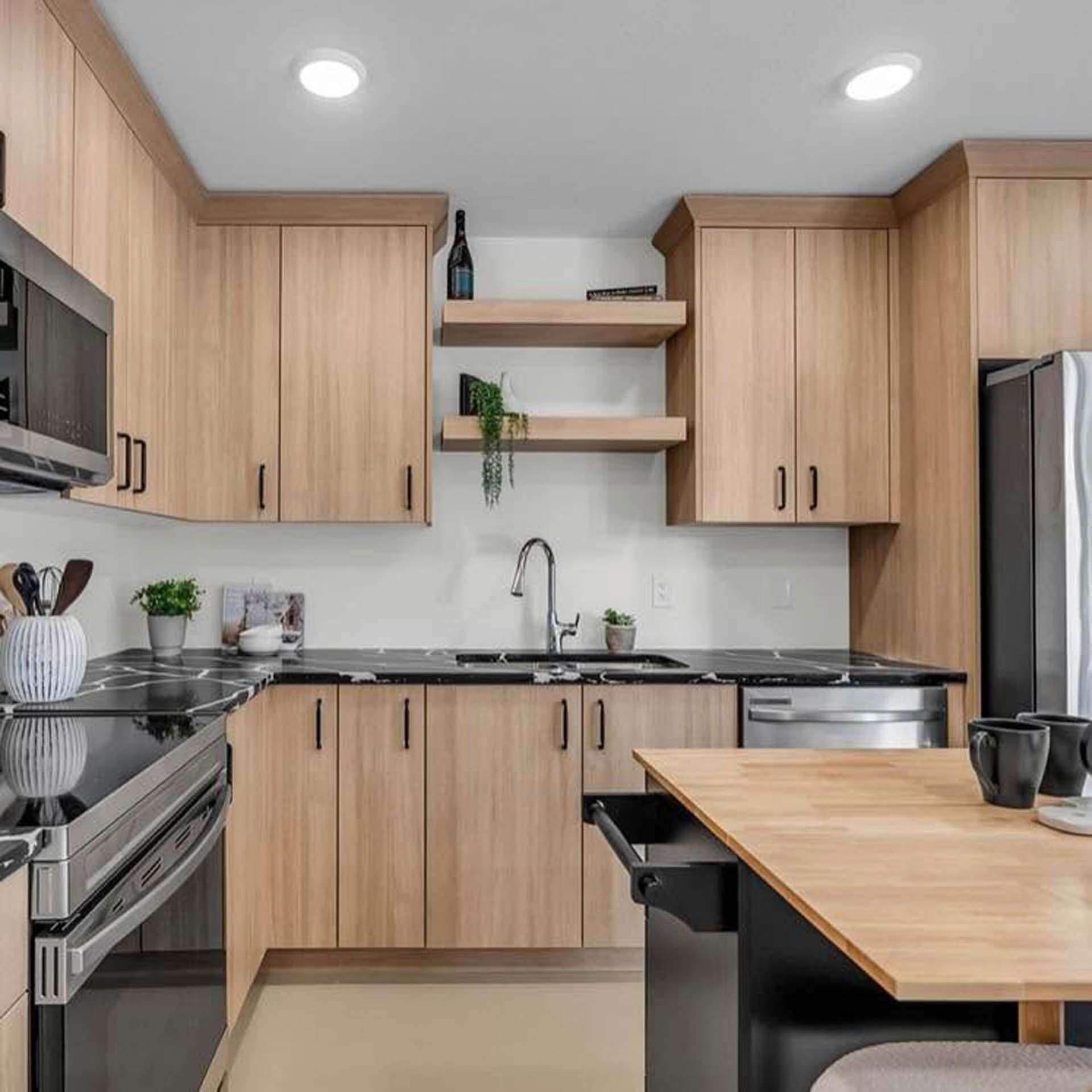 Wood kitchen cabinetry with open shelving