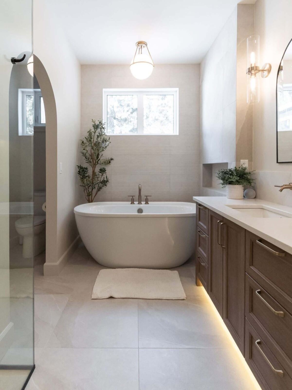 Vanity beside a freestanding tub